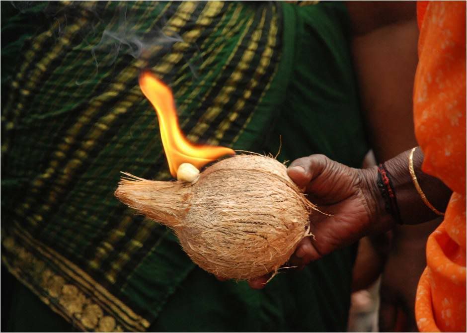 pooja coconut and burning camphor