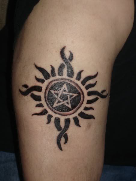boy named Jake hides in a basement with a pentagram tattooed on his arm.