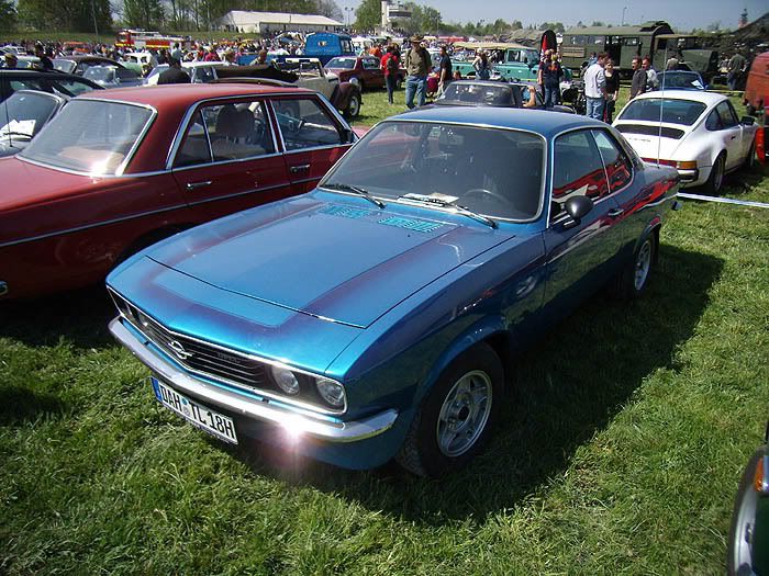 Opel Manta A Chevrolet Camaro with a Mercedes W114 W115 next to it