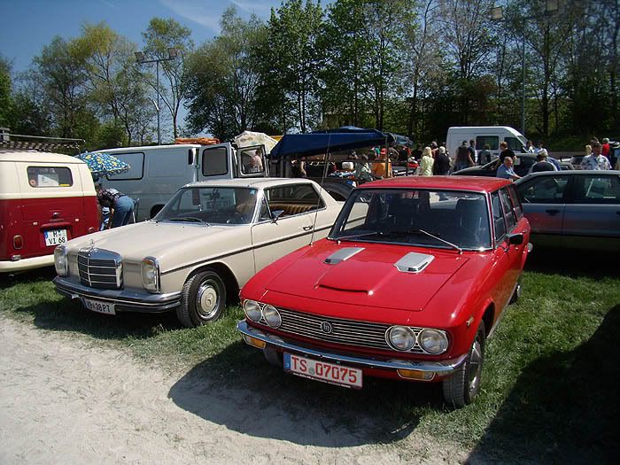 A Mercedes W114 Coupe and a mystery car A Fiat perhaps