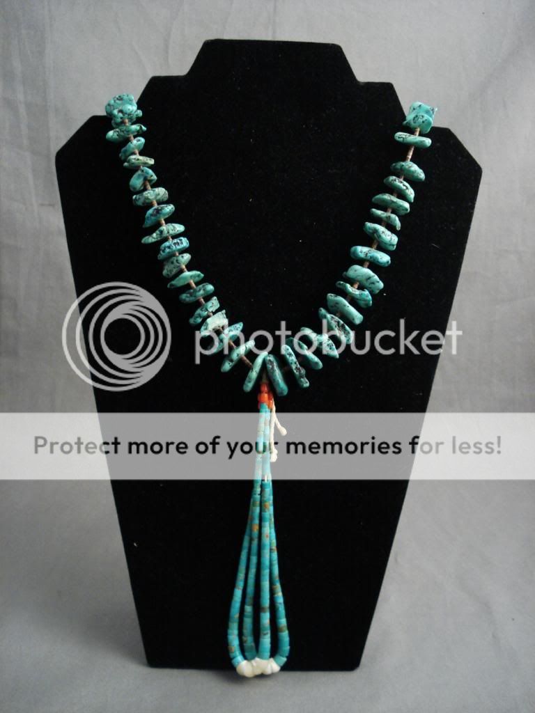   this necklace features hand cut graduated turquoise stones segmented